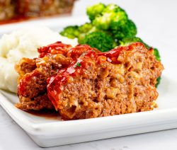 Bone Suckin' Sweet Southern Meatloaf on a plate with broccoli and mashed potatoes