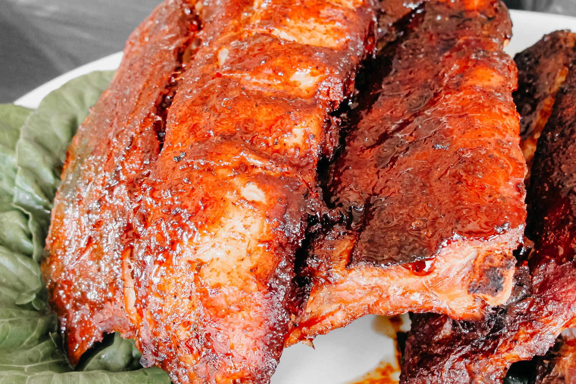 Bone Suckin' Dry Rub Ribs with Hot Honey Recipe: Ingredients Bone Suckin'® Seasoning & Rub, 3 oz Bone Suckin'® Hot Honey, 2 oz Racks of Baby Back Ribs, Spareribs, 3 Method Step 1 Coat both sides of the ribs evenly with Bone Suckin’® Seasoning & Rub. Cover and marinate 4 to 8 hours in the refrigerator. Step 2 Cook the ribs, in a covered dish, in the oven at 300˚ F for 3 hours. Uncover, sprinkle additional rub over the ribs and continue cooking food for an additional hour. Step 3 After removing ribs from oven, drizzle with Bone Suckin'® Hot Honey and allow to rest for 5 minutes. Enjoy!