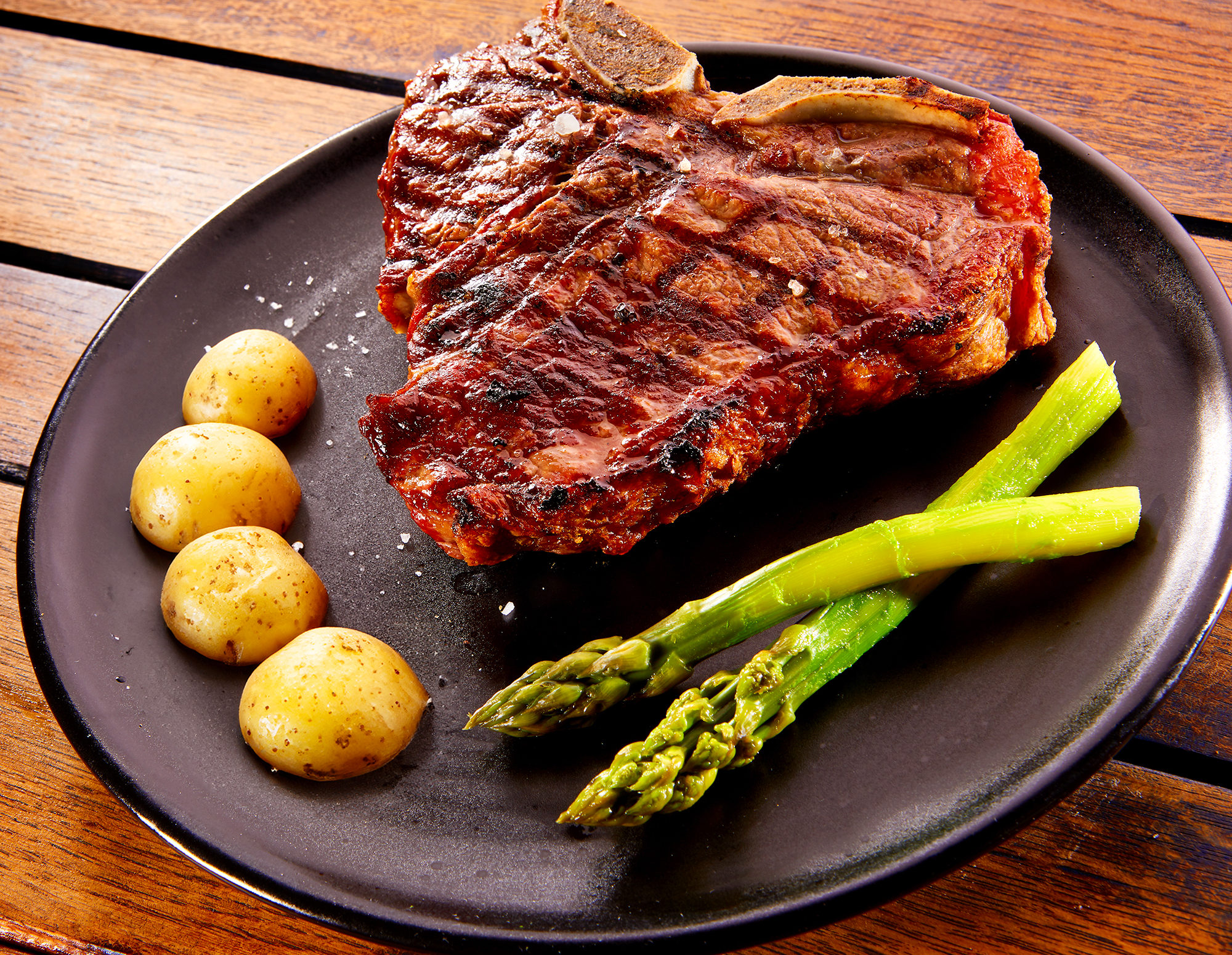 Steak, Potatoes, and asparagus on a plate