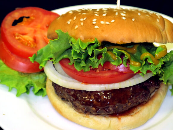 Burger with Bone Suckin' Sauce and Bone Suckin' Mustard, Lettuce, Tomato, Onion