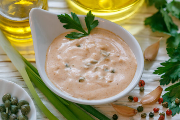 Spicy Mustard sauce in a bowl with ingredients around it