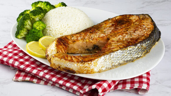 Salmon steak on a plate with a lemon