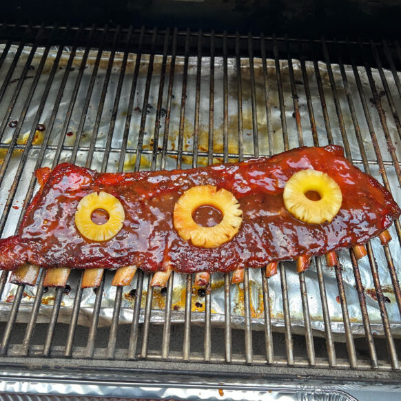 Rack of ribs on the grill with Pineapple rings